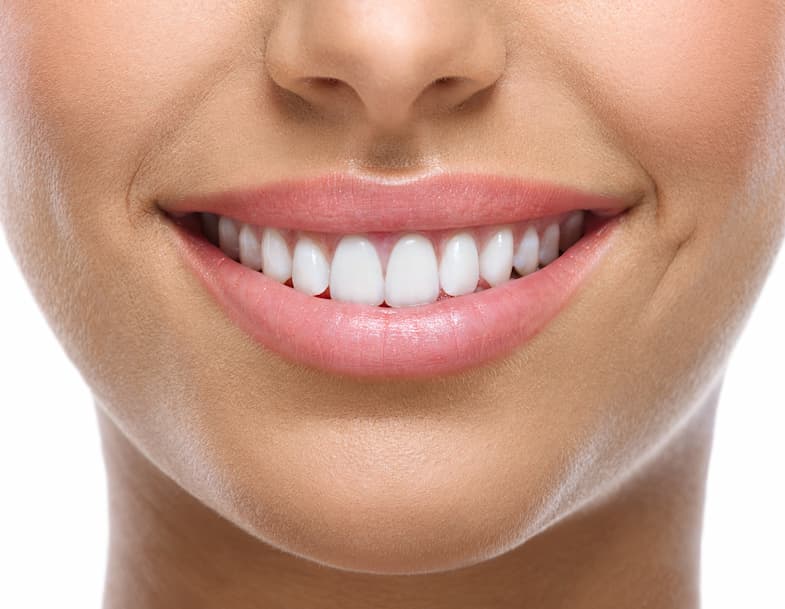 Close up of woman's perfect white teeth smiling