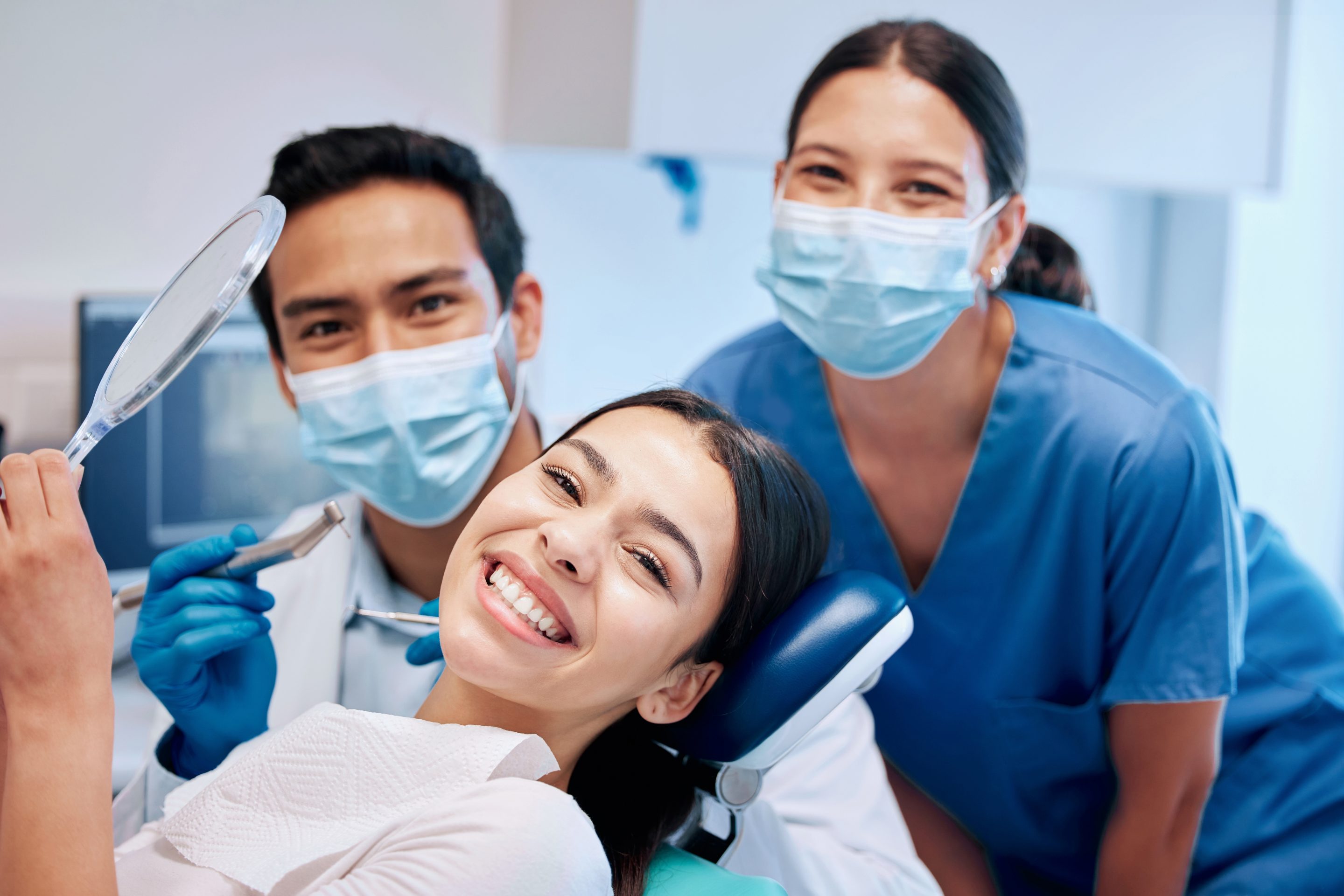 Expert Dental Care in Mission Viejo. Smile, mirror and portrait of woman with dentist after teeth whitening, service and dental care. Healthcare, dentistry and female patient with orthodontist for oral hygiene, wellness and cleaning