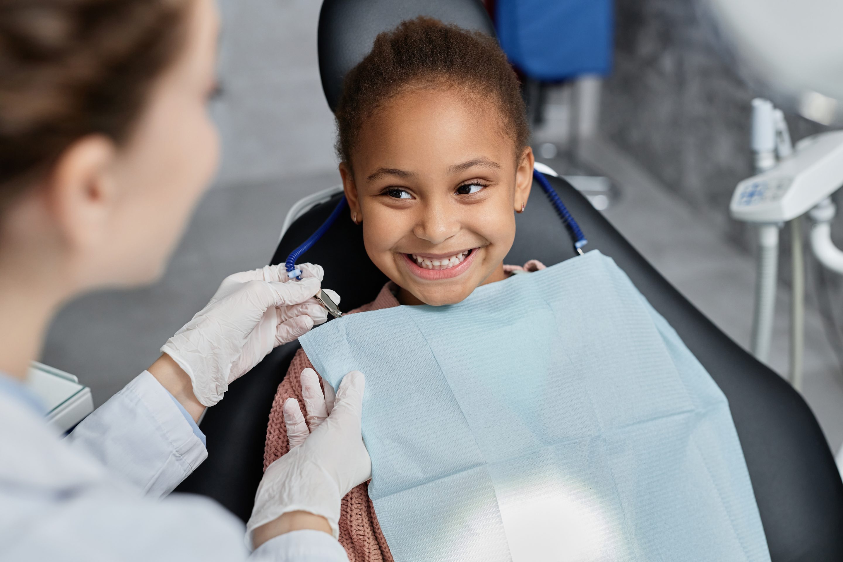 Child at dentist smiling
