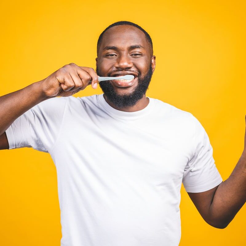 Man with a healthy smile practicing good oral health and nutrition in Lake Forest, California.