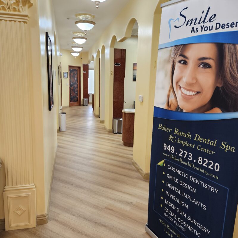Dental office hallway with service banner.